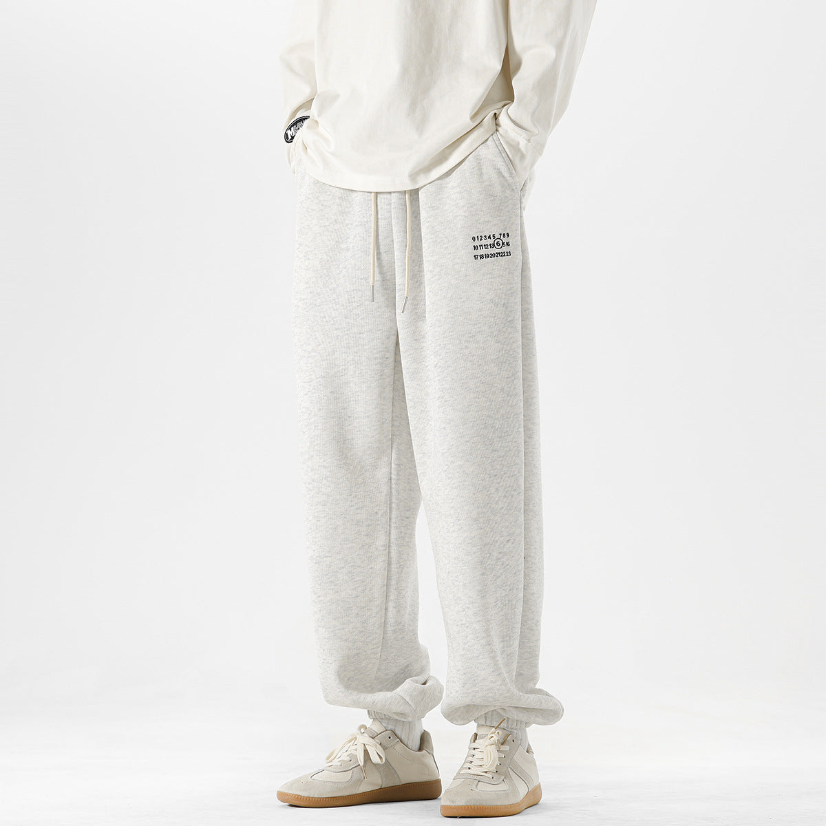 Men's Simple Digital Embroidery Loose Sports Sweatpants by GJG Denim